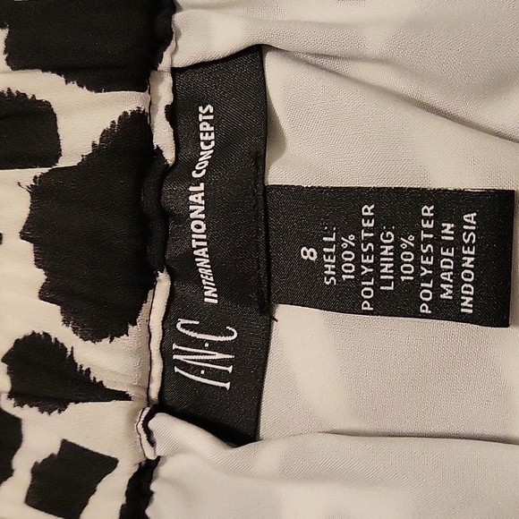 *NWT Inc. Emerald Asymmetrical Giraffe Print Mid Rise Lined Skirt. - Picture 9 of 11